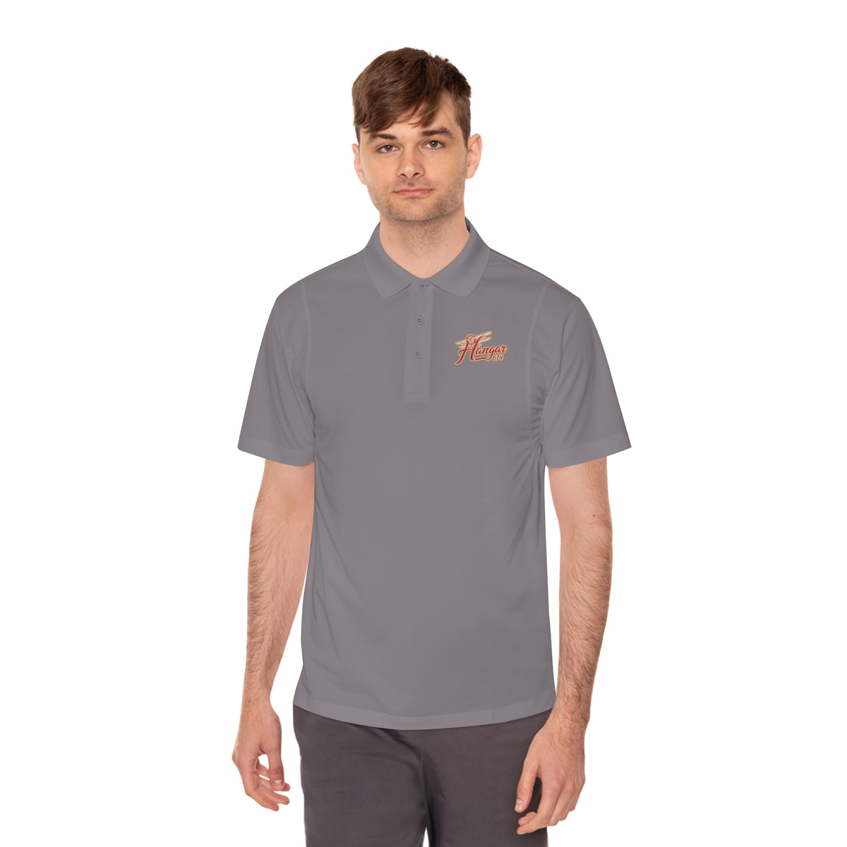 Grey concrete Hangar 614 men's performance polo worn from the front
